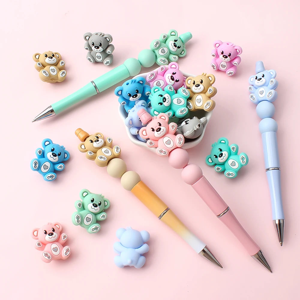 A collection of colorful 3D silicone bear focal beads in various shades and sizes for DIY jewelry making.
