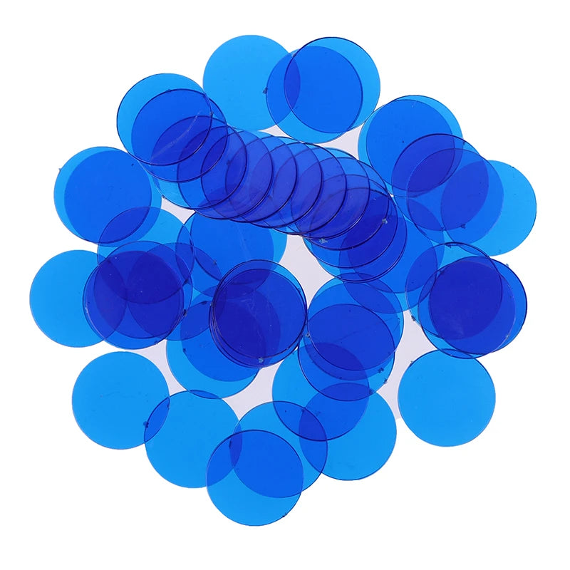 A pile of bright blue plastic bingo chips for games and family fun