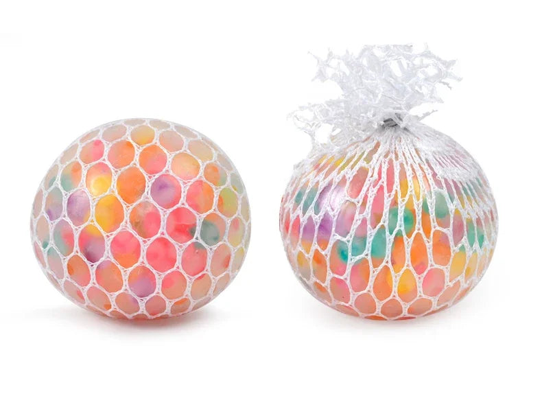 A rainbow squishy stress relief ball with colorful, translucent, squishy material tied with white netting.