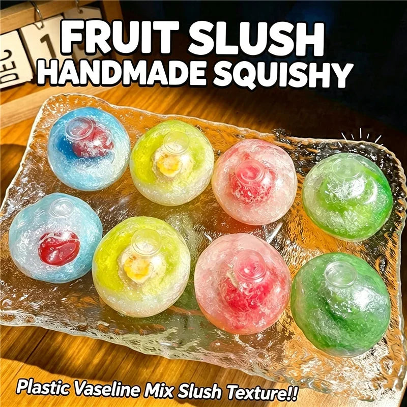 Handmade fruit slushy squishy balls in various colors resting on a glass plate