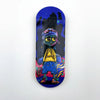 A wooden fingerboard deck featuring a UV-printed graphic of a stylized, blue-skinned character with purple hair and goggles a