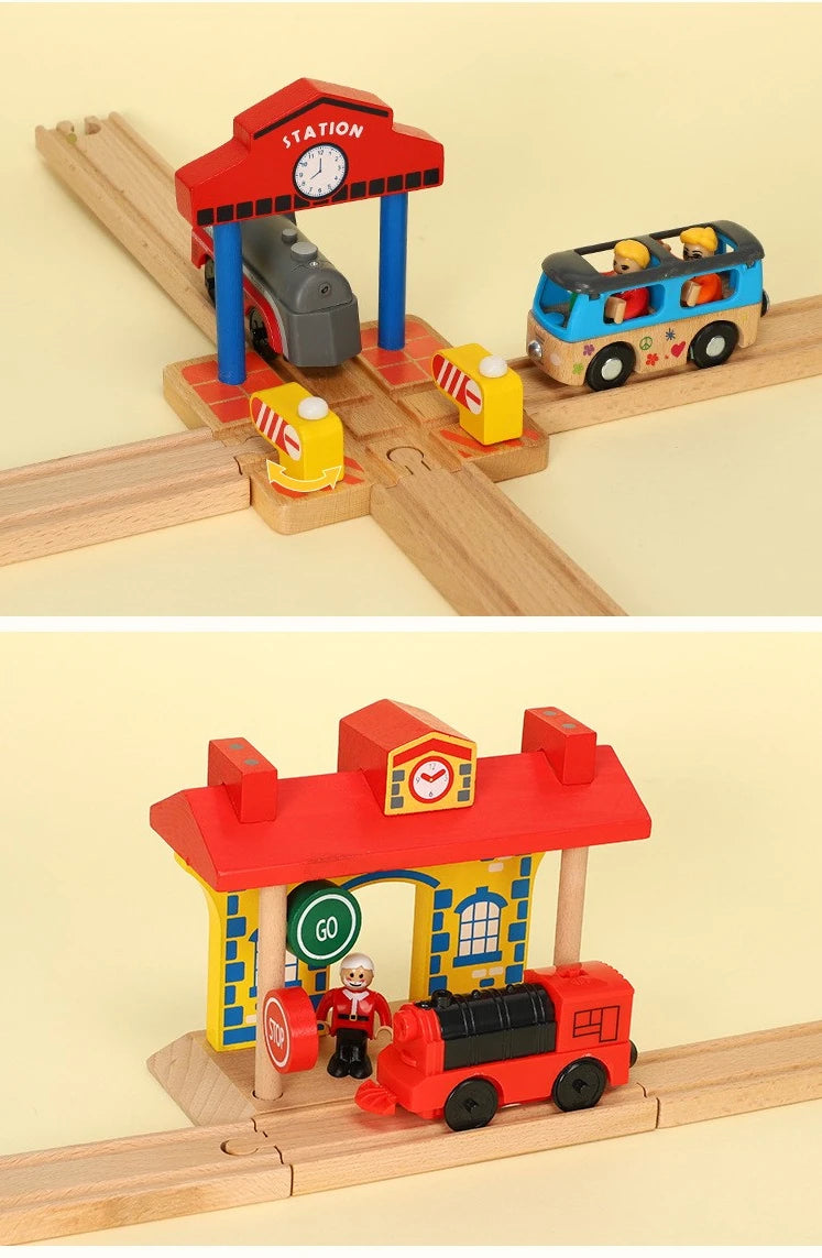 A wooden train track accessory set featuring a red station building and a blue train on a wooden track.