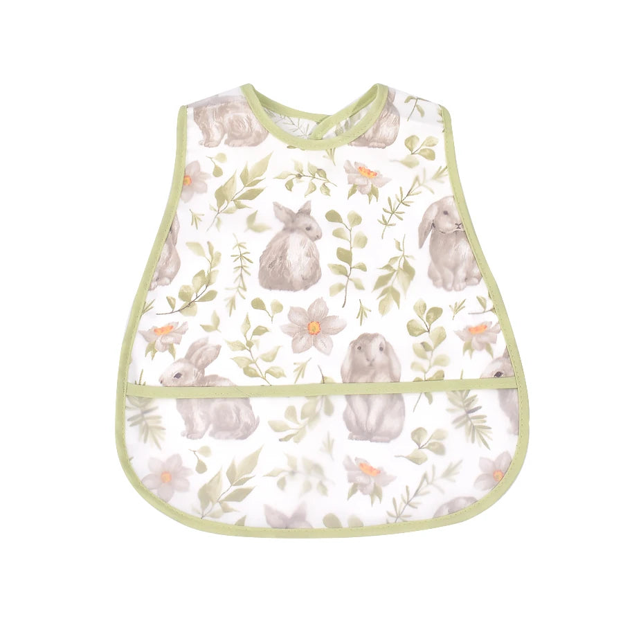 A light green baby bib featuring a watercolor pattern of gray rabbits and green foliage.