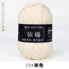 A ball of cream colored milk cotton yarn labeled with Chinese characters and a number 19
