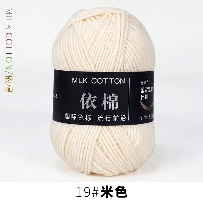 A ball of cream colored milk cotton yarn labeled with Chinese characters and a number 19