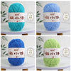 A collection of soft chenille yarn balls in various shades of purple, teal, blue, and green, displayed against a white backgr