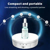 A small, clear electronic device sits on a white base, surrounded by icons illustrating its features like multi-angle adjustm