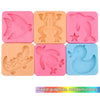 A set of five pink and orange silicone molds for DIY craft kits featuring ocean creatures like a fish, crab, dinosaur, and du