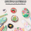 A collection of multi-colored acrylic gel pens and drawing tools displayed on a light background.
