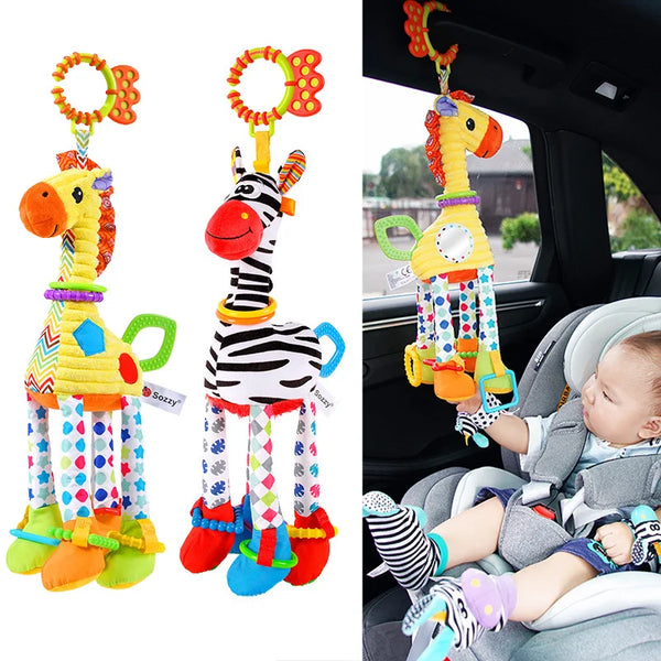 A plush toy of a giraffe and zebra with attached handbells, being held by a baby.