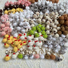 A collection of handcrafted crochet animal keychains in various colors and textures, including rabbits, chicks, cats, and dog