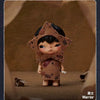 A brown collectible figurine of a character wearing a leaf-shaped mask and armor, set against a neutral background.