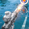 A close-up of an electric water gun with a light and flame effect, aimed at a target in water.