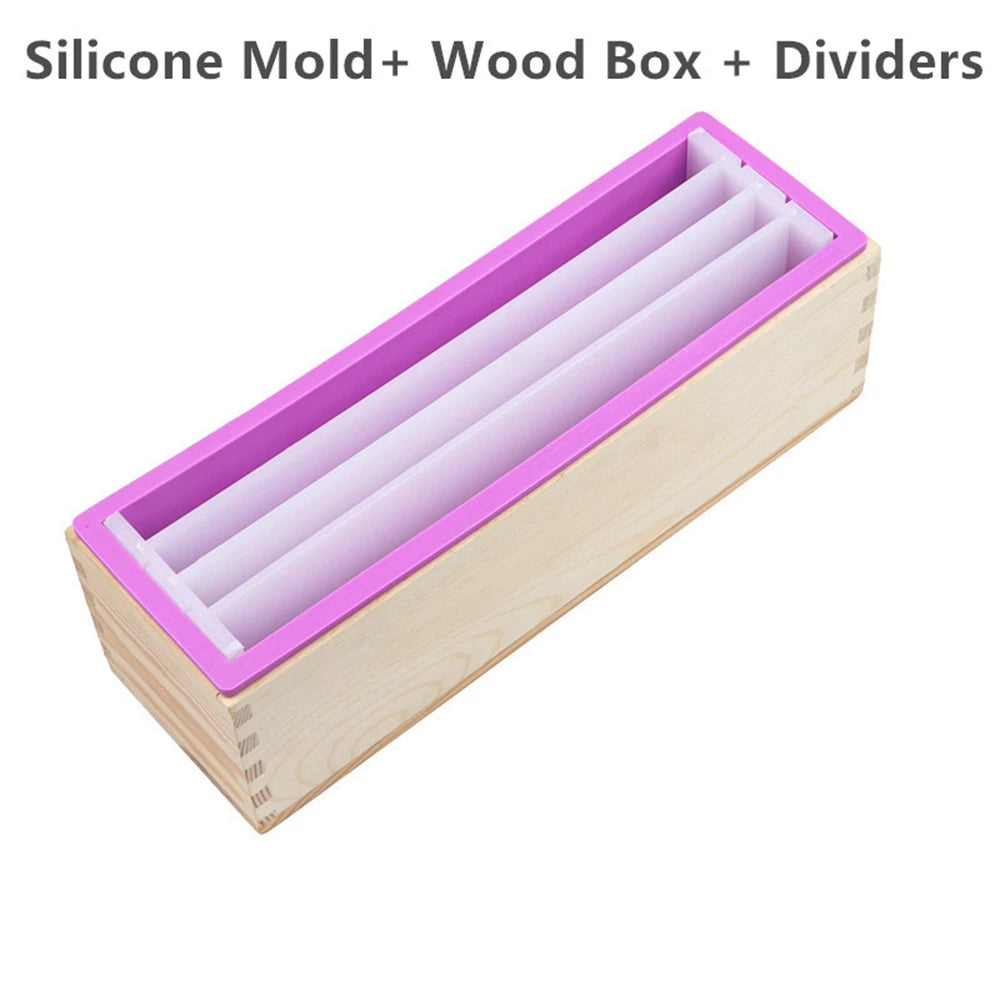 A rectangular silicone mold with a purple interior is housed in a light wood box with dividers.