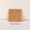 A square brown kraft card with two small holes is shown on a white background.