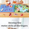 A young girl is using a Montessori quiet book with themed sticker activity sets for fine motor skill development.