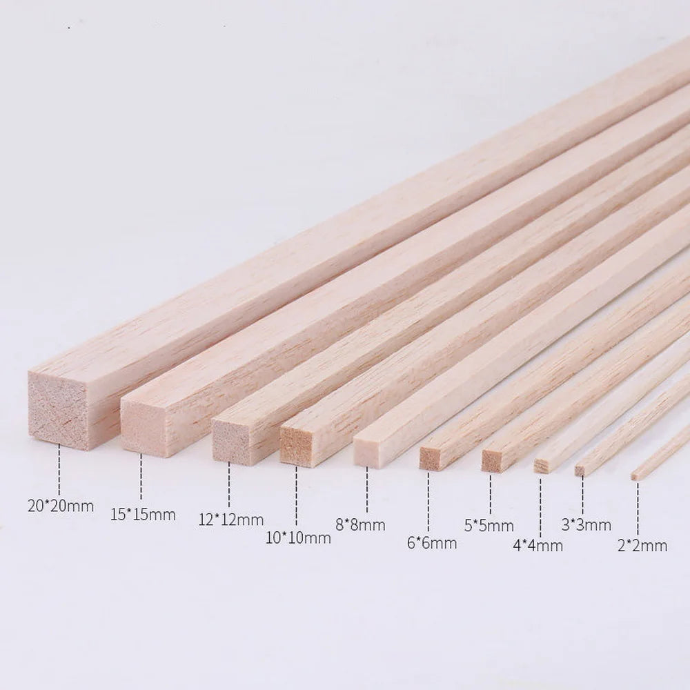 A collection of natural solid wood strips of varying thicknesses and lengths, shown laid out for DIY crafts.