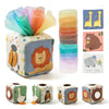 A set of Montessori soft fabric tissue boxes and sensory toys for babies in various colors and patterns.