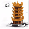Three yellow crane tower micro building blocks set model kit with detailed architecture.