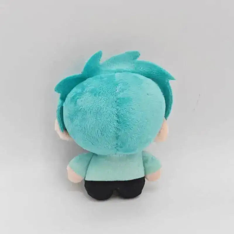 A teal plush doll with spiky blue hair and a light green body, shown from the back.