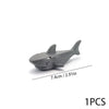 A gray plastic model of a marine creature, measuring 7.4cm long.