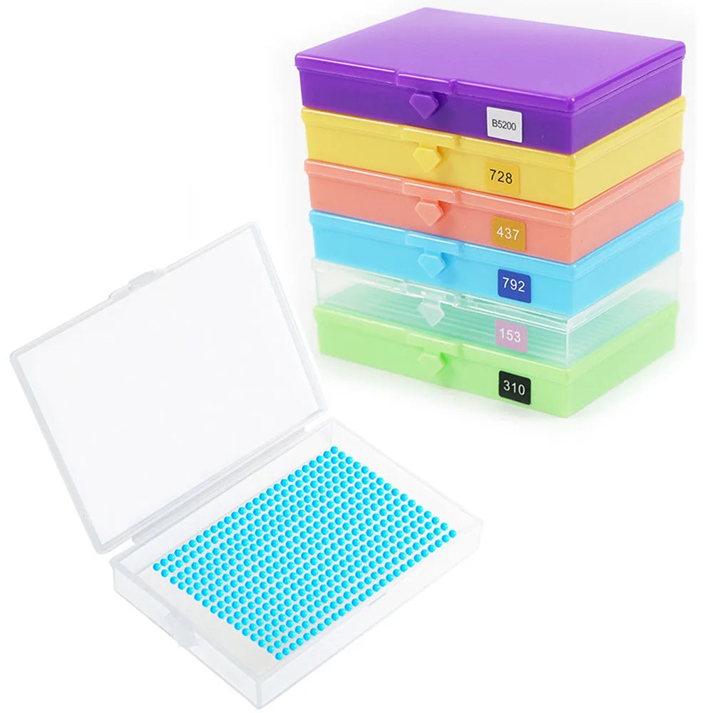 A set of colorful diamond painting storage organizer boxes stacked and an open box with a plastic tray.