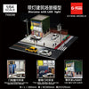 1/64 scale diorama of a building with a rolling shutter door and a parking lot featuring miniature cars.
