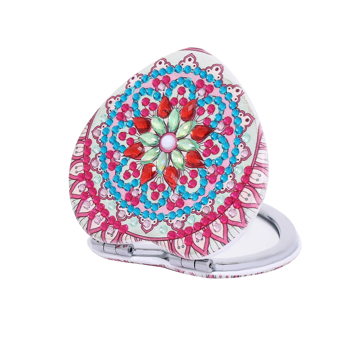A folding mirror with a pink and blue floral design on the cover.