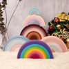 A colorful rainbow arch made of soft silicone building blocks displayed on a light surface.