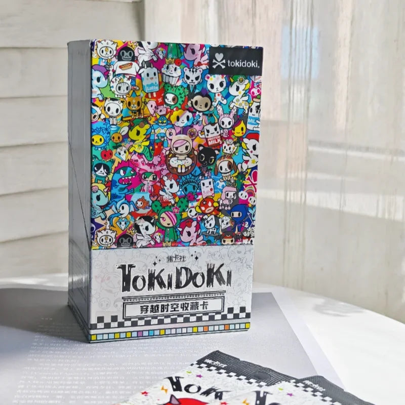 A box of Tokidoki Unicorn Adventure Journey Series Vol.1 collectible cards featuring colorful unicorn characters.