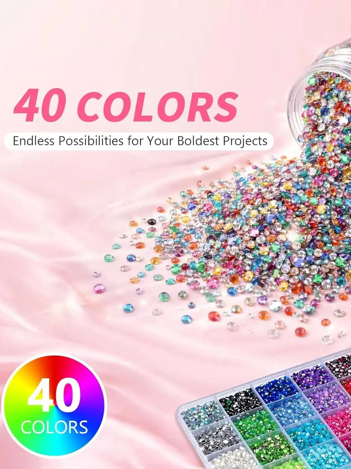 A pile of 40 colors of 3mm flatback resin jelly rhinestones with adhesive craft gems scattered on a pink surface.