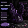 A dark purple rabbit plush toy with a bandage design and a metal keychain attached.