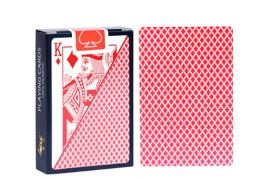 A box of red playing cards with a king face design and a deck of red diamond playing cards.