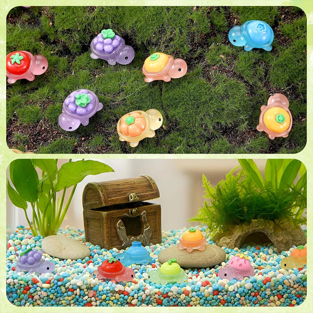 A collection of glow-in-the-dark turtle resin figurines in various colors scattered on green moss and colorful pebbles.