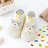 A pair of adorable animal soft sole sock shoes for babies and toddlers with cute face designs