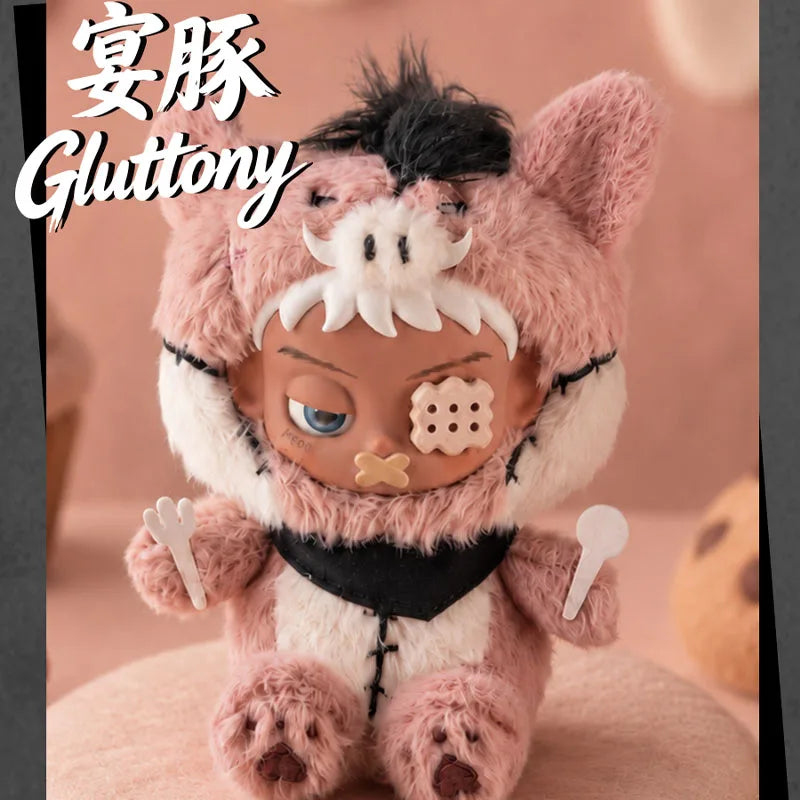 A fluffy pink and white plush figure resembling a cat face with dark features, displayed against a soft background.