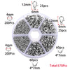 A circular plastic tray containing various silver-colored jewelry findings including lobster clasps, jump rings, and crimps.
