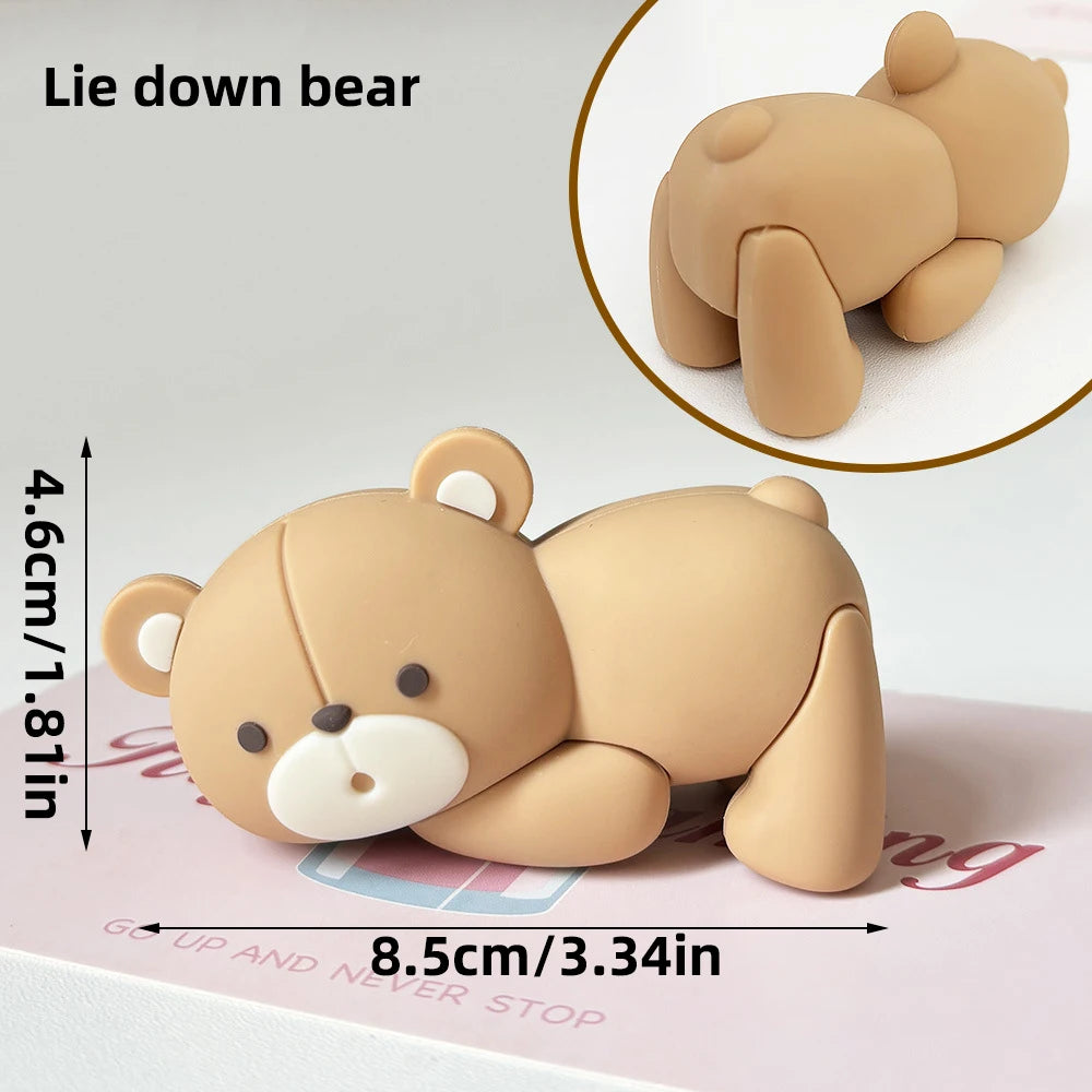 A light tan bear cake topper is shown lying down and in a close-up view, measuring 4.6cm or 1.81in.