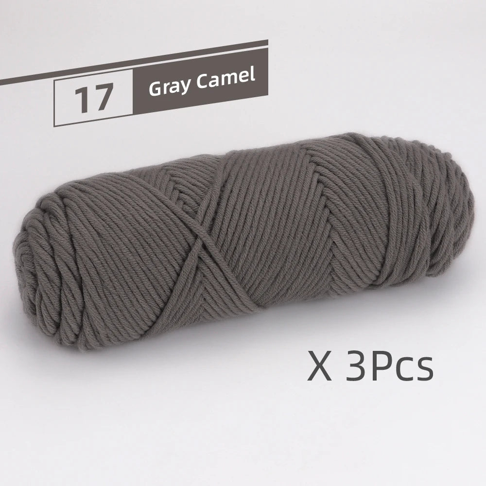 Gray Camel yarn skeins shown in a coiled bundle, ready for knitting or crochet projects.