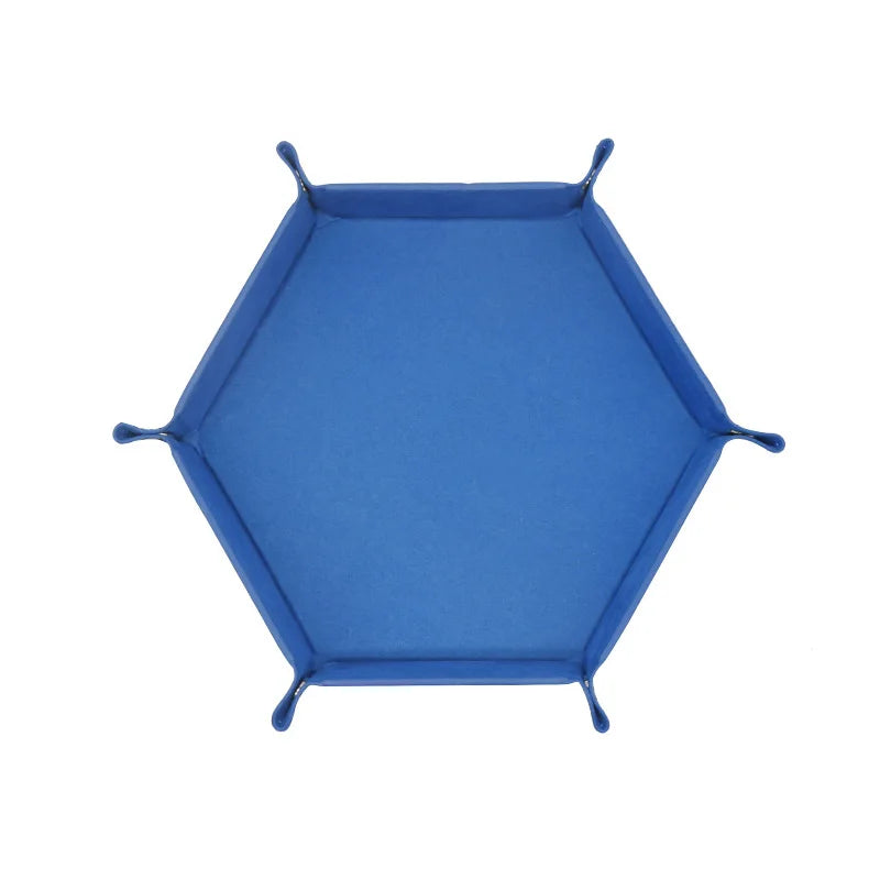 A royal blue foldable PU leather hexagonal dice tray for tabletop games and desk organization.
