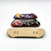 A wooden fingerboard deck with a UV-printed graphic featuring a stylized character.