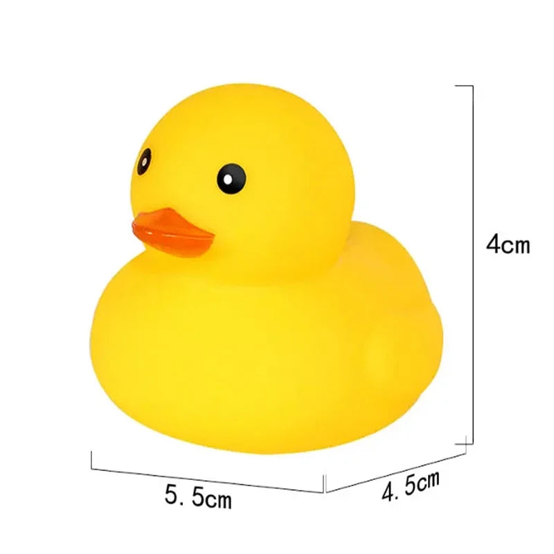 A bright yellow rubber duck toy with an orange beak and eye, shown from above.