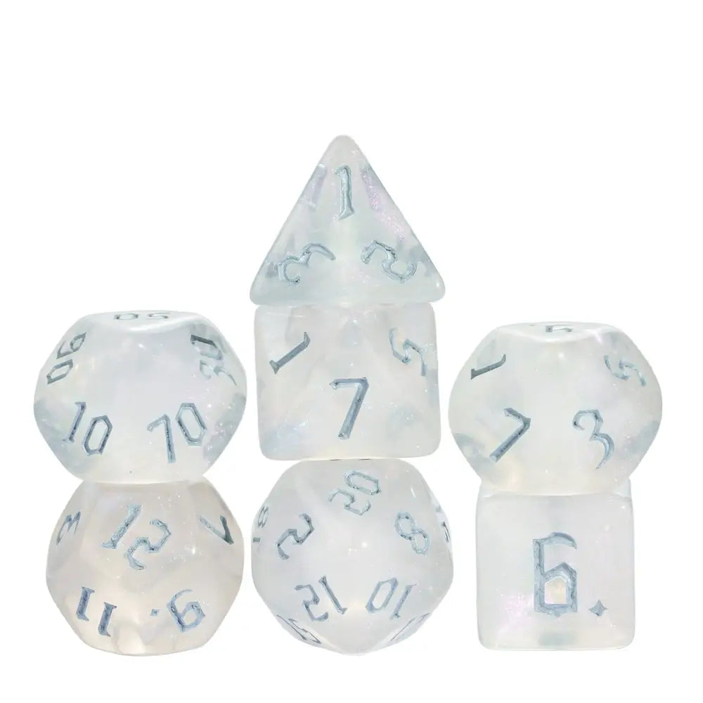 A set of seven translucent glitter polyhedral dice, including a pyramid and various polyhedra shapes.