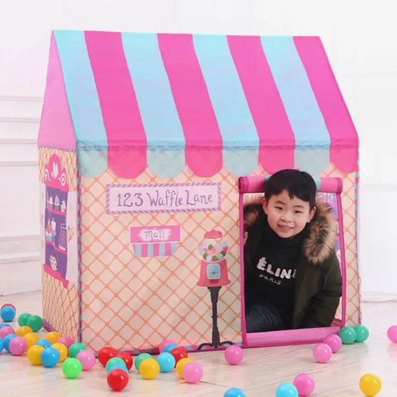 A pink and blue striped foldable kids play tent with a purple fabric front and a small decorative item.