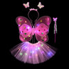 A pink LED butterfly costume set for girls featuring glowing wings, a skirt, and a wand.