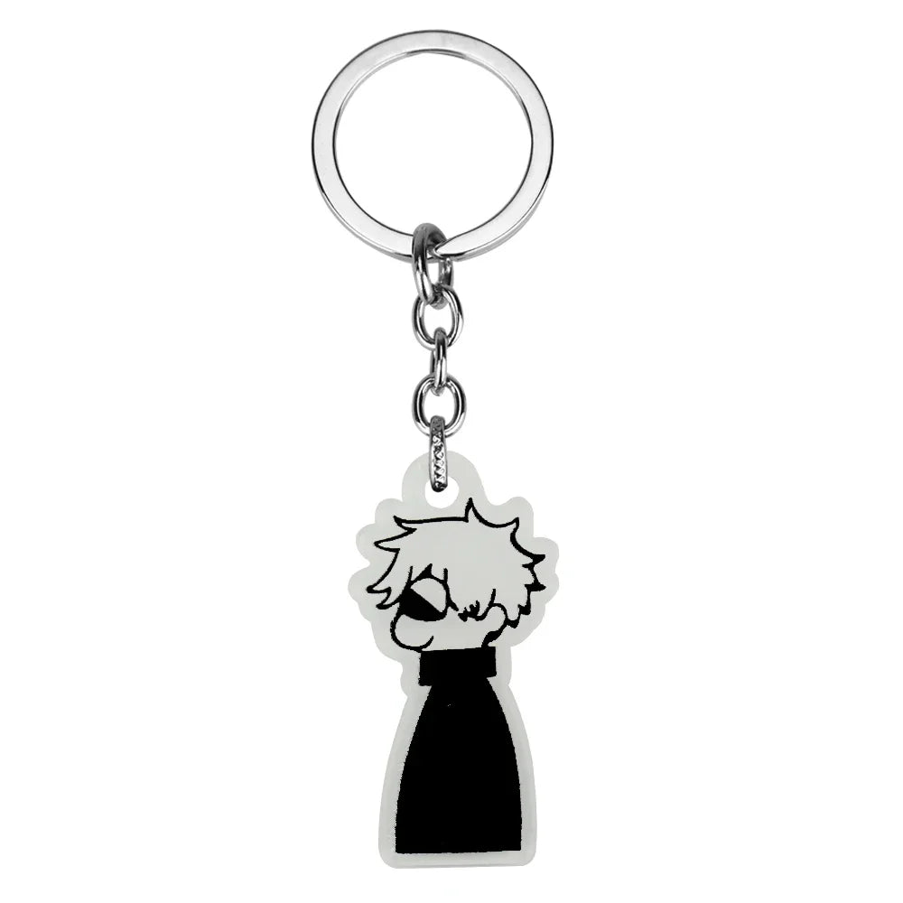 Silver keychain featuring a black silhouette of a character with white hair and a black collar.