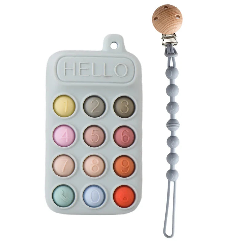Silikon-Fingerpuppe mit Teddybär-Design, nummerierten Fingern und Holzschlaufe.