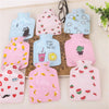 A collection of pink and blue portable hot water bottles with various fruit and animal patterns.