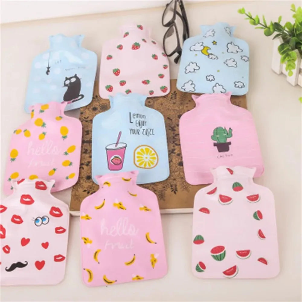 A collection of pink and blue portable hot water bottles with various fruit and animal patterns.