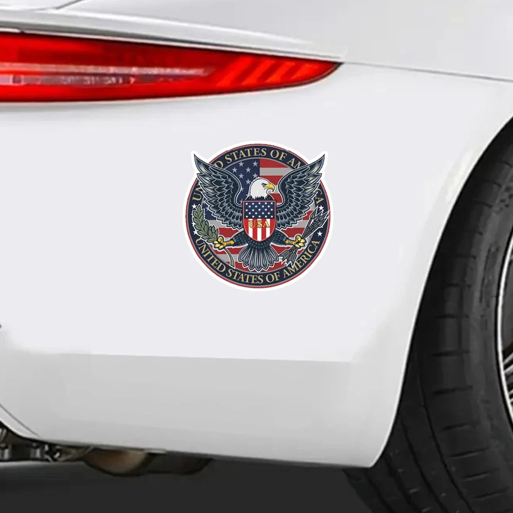 A patriotic American eagle vinyl decal featuring the flag and text on a white car body panel.